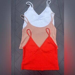 Three TopShop cropped tank tops: orange, cream and white, thin straps, size 4